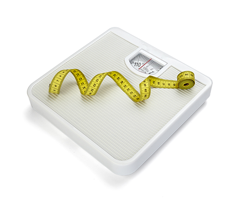 Scale with a tape measure on it