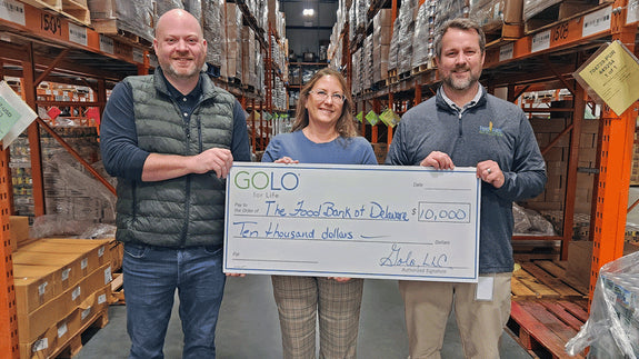 Jen Brooks presenting a check to the food bank of Delaware. 