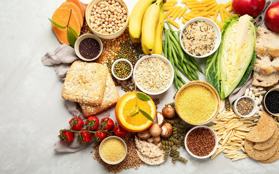 Variety of fruits, veggies, whole grain bread, and other healthy carbs