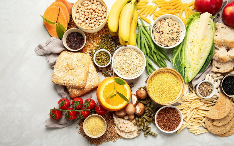 Variety of fruits, veggies, whole grain bread, and other healthy carbs