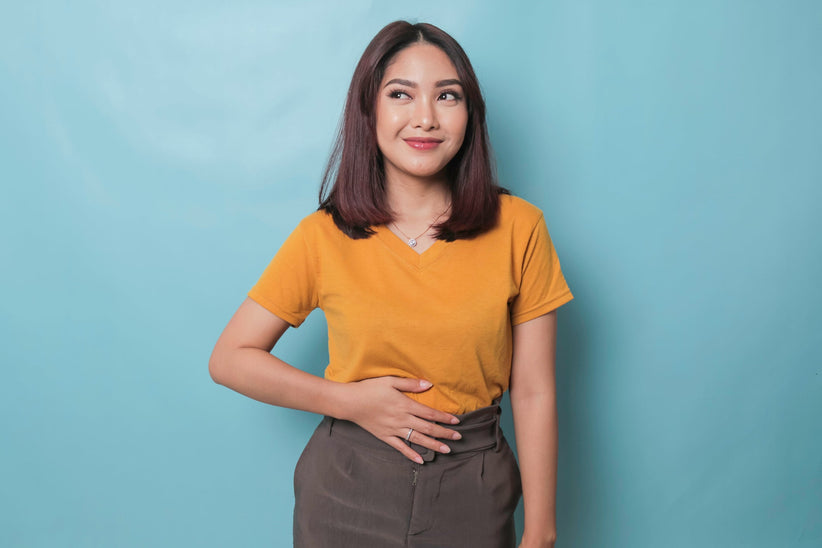 Woman who looks hungry holding her stomach