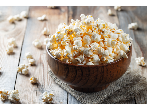Bowl of air-popped popcorn on a nice wooden table