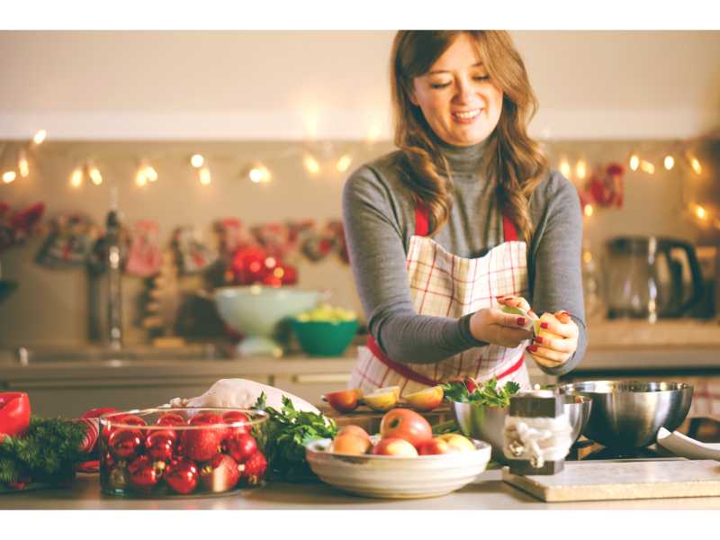 Woman making healthy holiday dinner in a festive kitchen