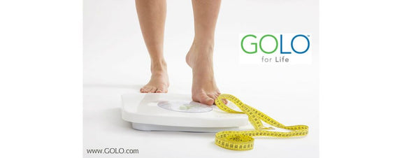 Person on scale with tape measure