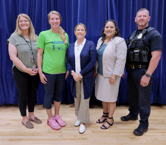 Photo of GOLO president Jennifer Brooks with W.B Simpsons staff members.