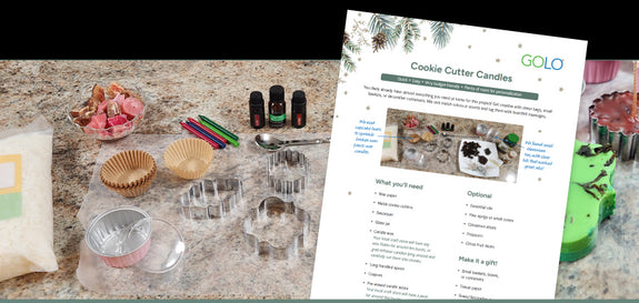 Cookie Cutter Candle instructions on a counter top next to items you need to create them. 