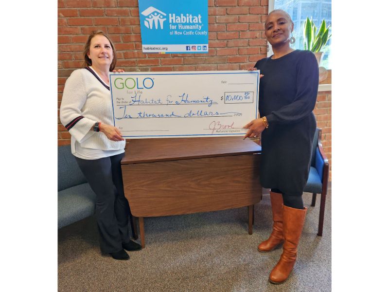 GOLO president Jen Brooks presenting a donation check to Habitat for Humanity of New Castle County