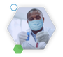 Scientist with mask on holding test tubes