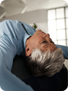 Senior woman stretching her back on the AeroTrainer