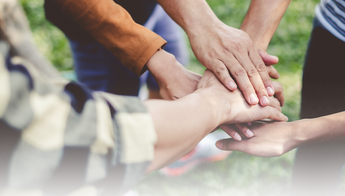 Hands together in a pile, be your BEST self on the image