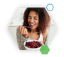Woman smiling and eating from a bowl