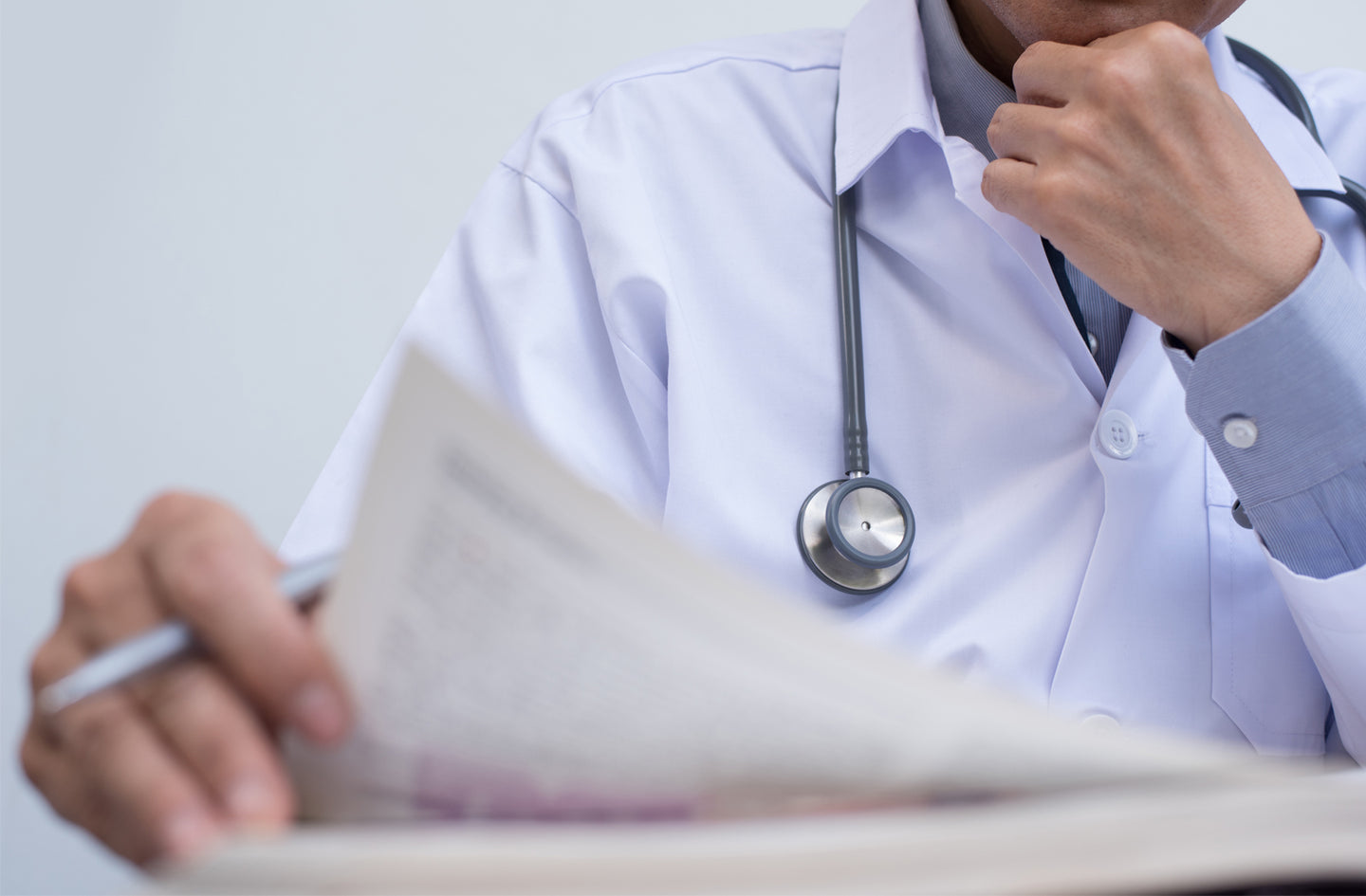 Doctor looking at a document